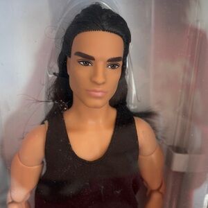 Barbie looks number 9 with Black Tank Top and silver pants. Made to move doll.